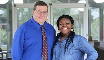 Photo of NFCC President John Grosskopf and Student Monica Powe